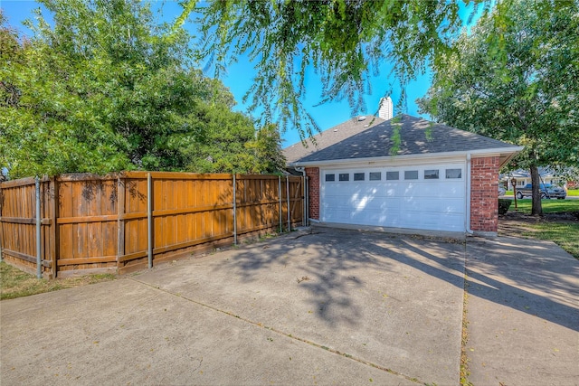 garage featuring fence