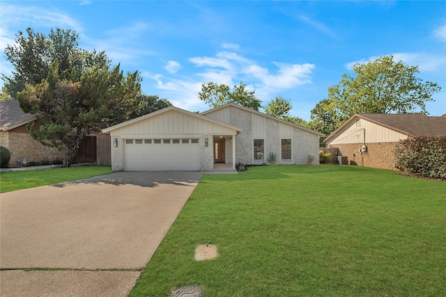 view of front of home featuring a garage and a front yard