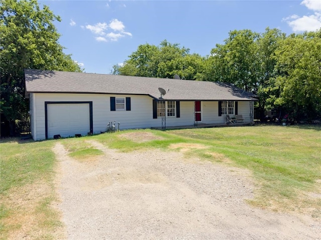 single story home with a front yard and a garage