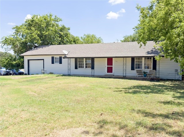 ranch-style house featuring a front lawn and a garage