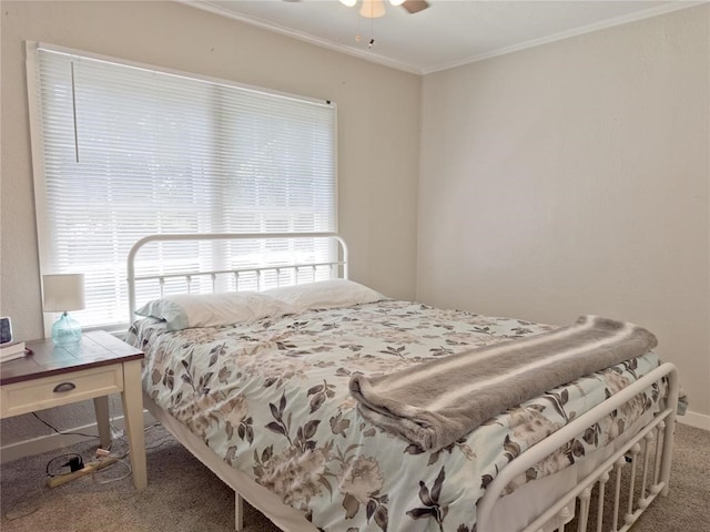 carpeted bedroom featuring ceiling fan and ornamental molding