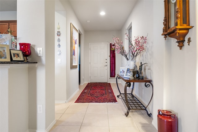 hall featuring light tile patterned flooring