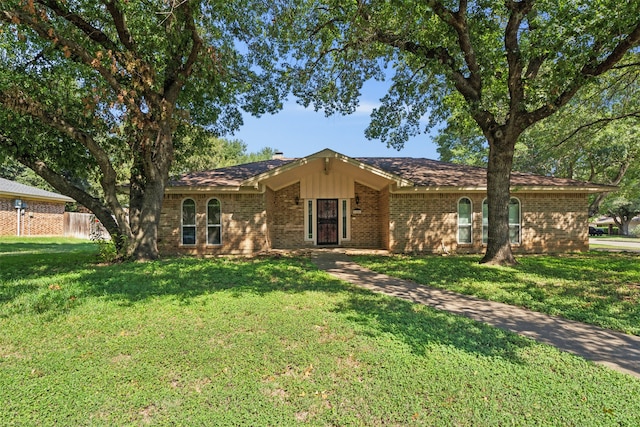 ranch-style house with a front lawn