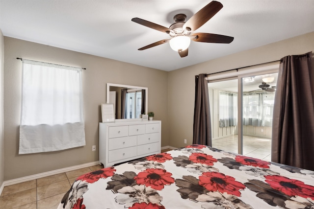 tiled bedroom featuring access to exterior, multiple windows, and ceiling fan