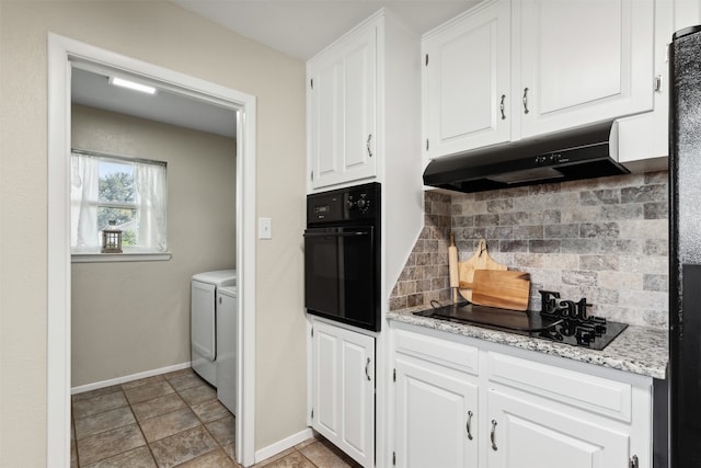 kitchen with white cabinets, backsplash, separate washer and dryer, and black appliances