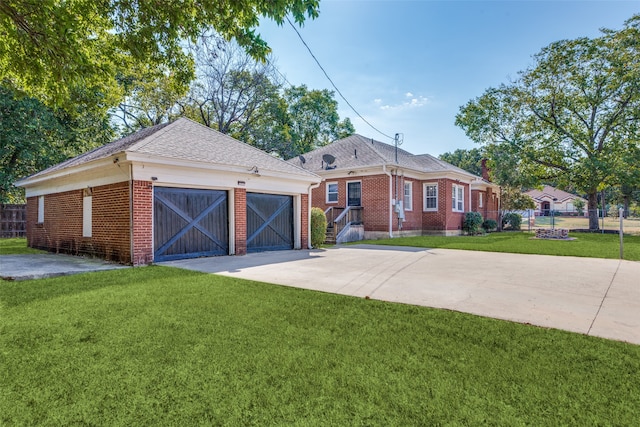 ranch-style house featuring a front yard and a garage