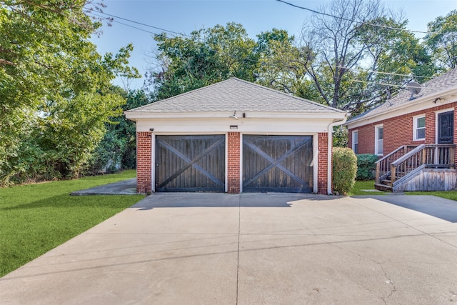 garage with a lawn