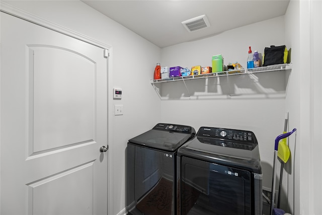 laundry area with washing machine and dryer