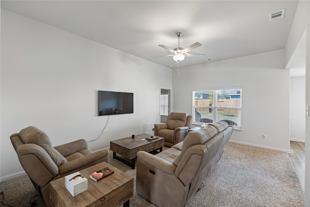 living room featuring ceiling fan and light colored carpet