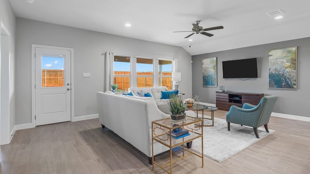 living room featuring ceiling fan and light hardwood / wood-style floors