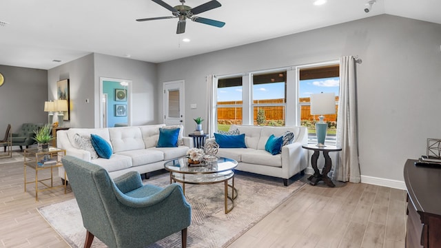 living room featuring ceiling fan and light wood-type flooring