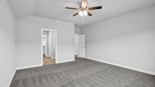 unfurnished bedroom featuring vaulted ceiling, carpet flooring, and ceiling fan