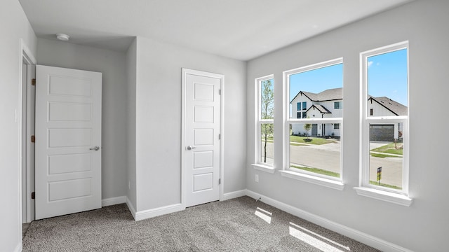 unfurnished bedroom with carpet floors and a closet