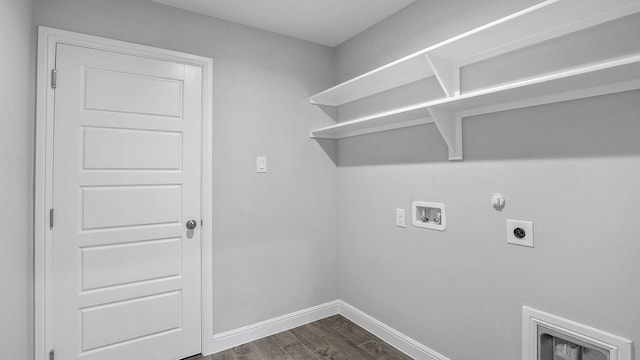 laundry room with washer hookup, gas dryer hookup, dark wood-type flooring, and hookup for an electric dryer