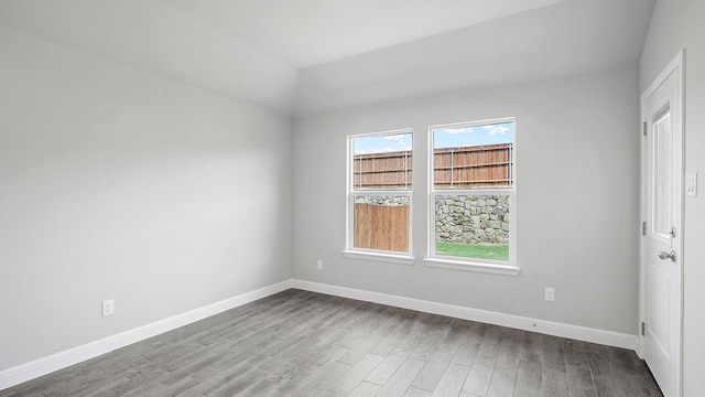 spare room featuring hardwood / wood-style flooring