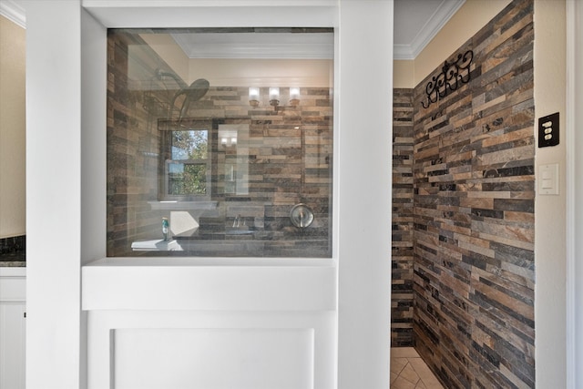 bathroom with ornamental molding and tile patterned flooring