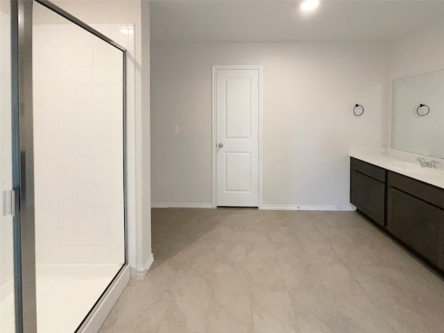 bathroom featuring an enclosed shower and vanity