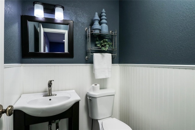 bathroom featuring sink and toilet