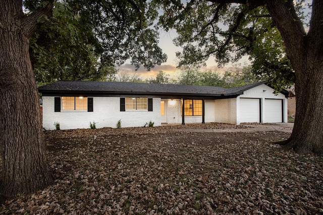 ranch-style home with a garage