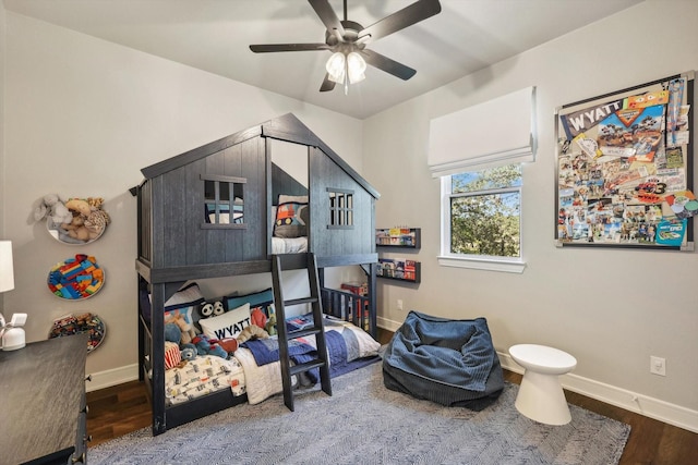 bedroom featuring ceiling fan and dark hardwood / wood-style floors