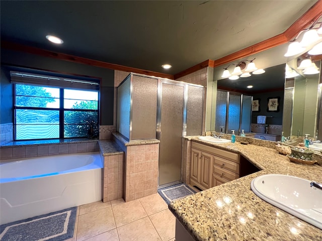 bathroom featuring tile patterned flooring, vanity, and plus walk in shower