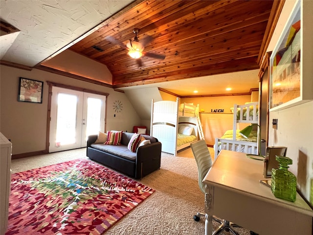 carpeted living room with french doors, ornamental molding, vaulted ceiling, and ceiling fan