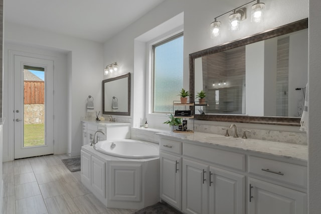 bathroom featuring vanity, plus walk in shower, and tile patterned floors