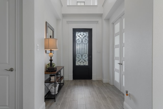 foyer entrance with light hardwood / wood-style floors