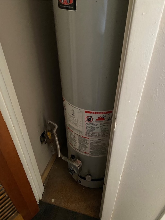 utility room with water heater