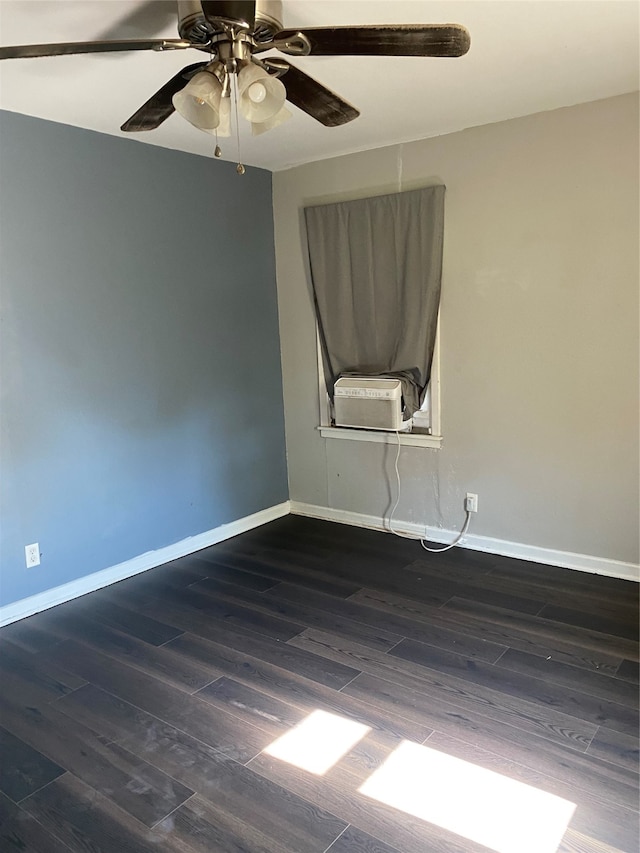 spare room featuring ceiling fan, cooling unit, and dark hardwood / wood-style flooring