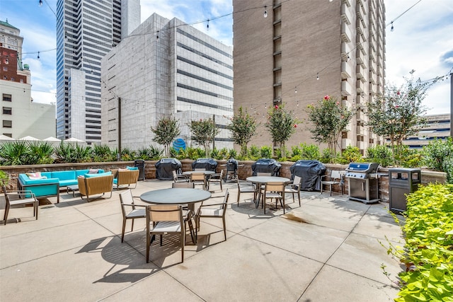 view of patio featuring an outdoor hangout area and a grill