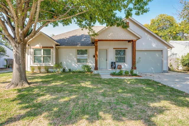 view of front of house with a front lawn and a garage