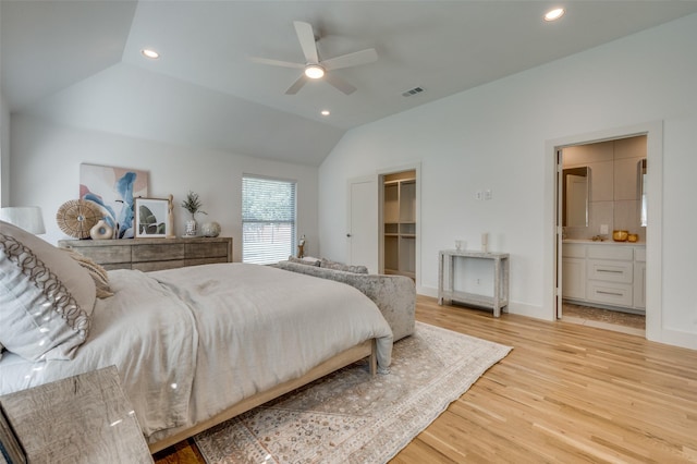 505 Sandra Dr, Irving, TX 75060 - bedroom featuring light wood-type flooring, lofted ceiling, a spacious closet, recessed lighting, and ensuite bath