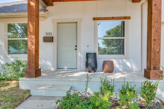 property entrance featuring covered porch