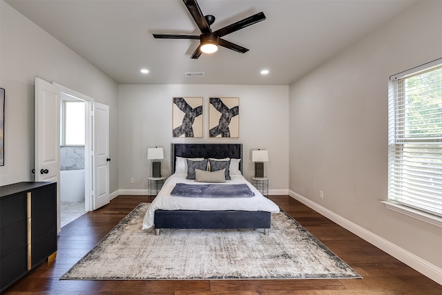 bedroom with dark hardwood / wood-style flooring and ceiling fan