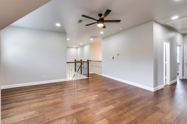 empty room featuring ceiling fan and hardwood / wood-style floors