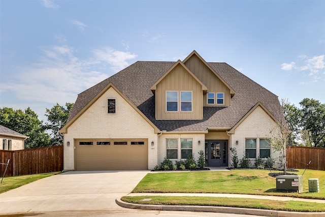 view of front of property featuring a garage and a front yard