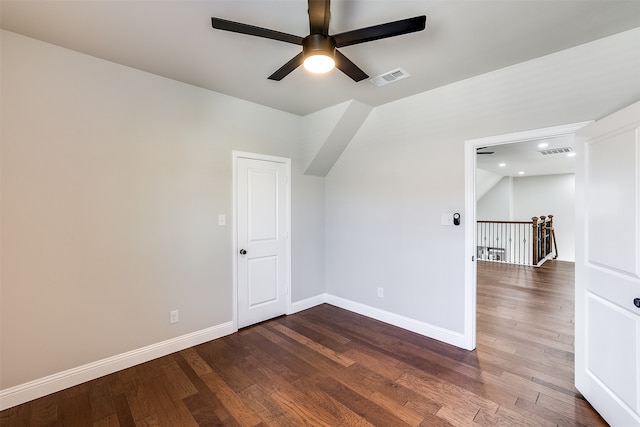 additional living space with lofted ceiling, dark hardwood / wood-style floors, and ceiling fan