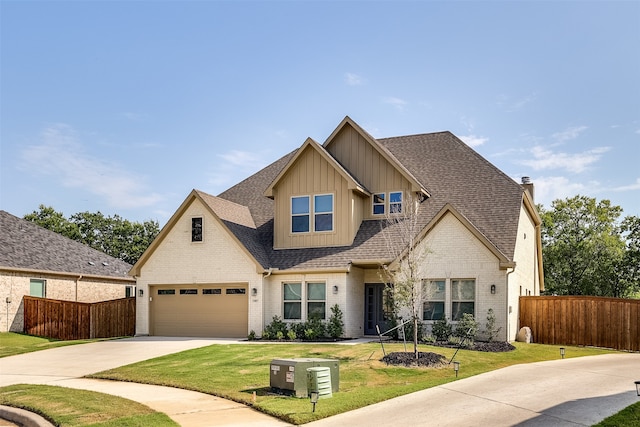 view of front of house featuring a front lawn and a garage