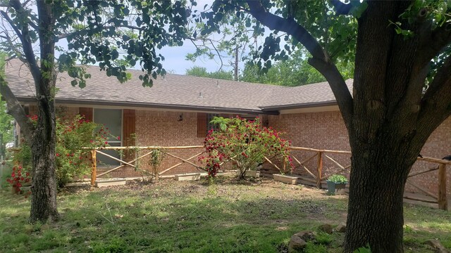 view of front of property with a front yard and a garage