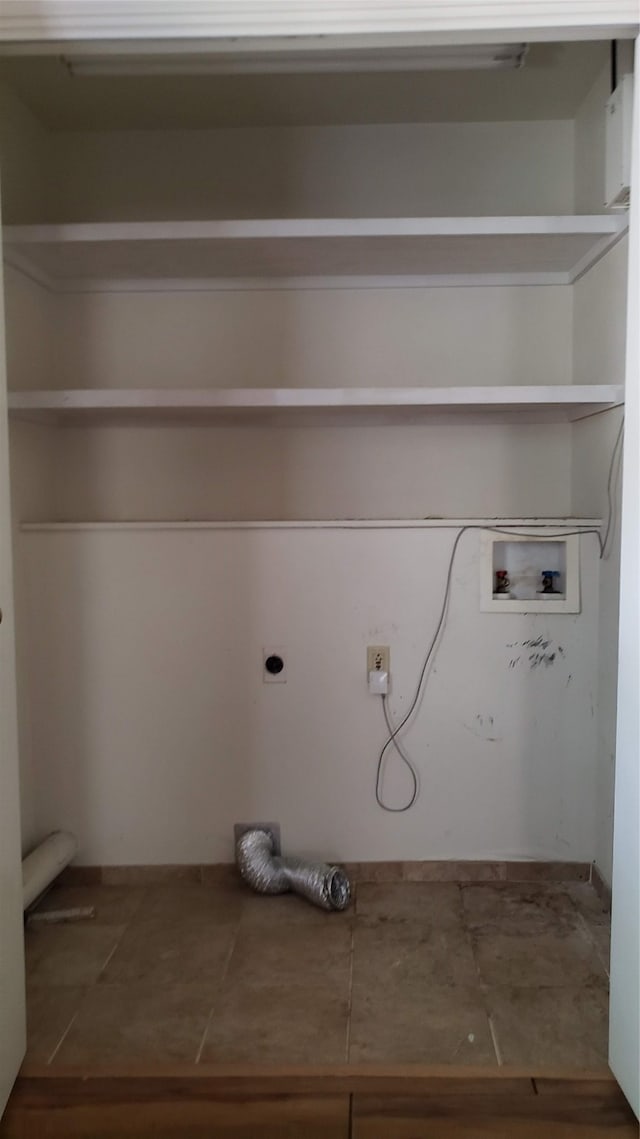 washroom with hookup for an electric dryer and hookup for a washing machine