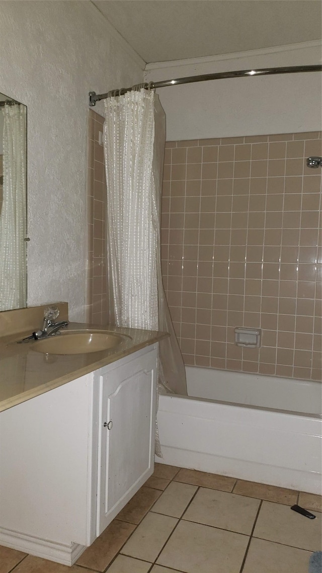 bathroom featuring tile patterned floors, shower / bath combo, and vanity