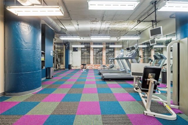 workout area featuring dark colored carpet