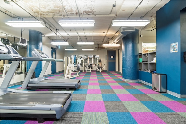 exercise room featuring dark colored carpet