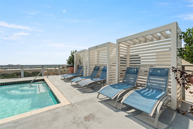 view of pool with a pergola and a patio area