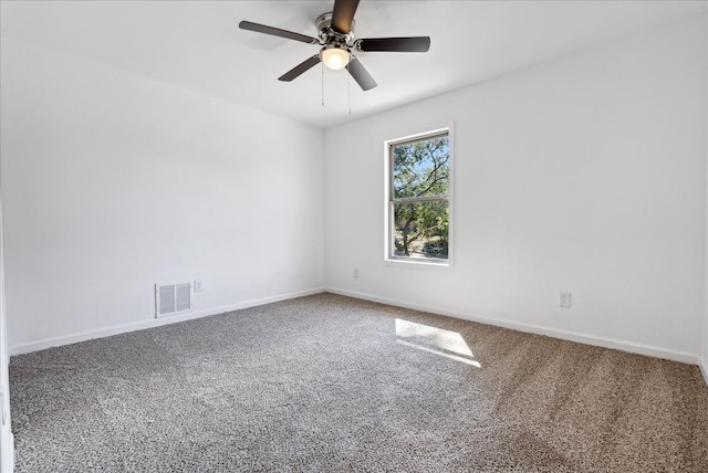 spare room featuring ceiling fan and carpet flooring