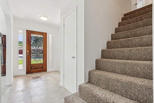 foyer featuring light tile patterned floors