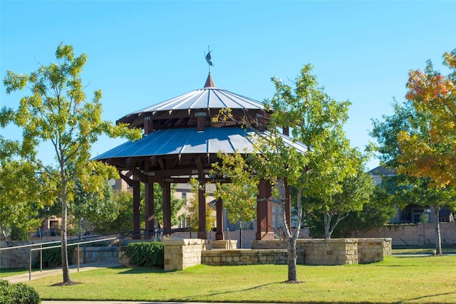 surrounding community with a yard and a gazebo