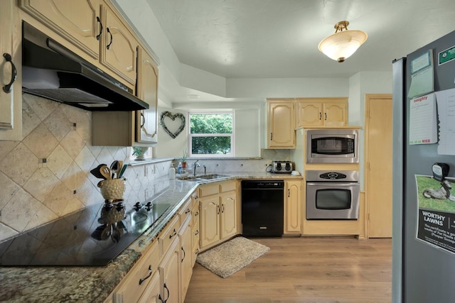 kitchen with light wood-type flooring, light brown cabinetry, sink, decorative backsplash, and black appliances