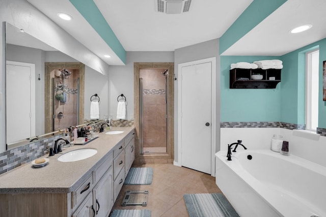 bathroom with vanity, tile patterned flooring, and separate shower and tub